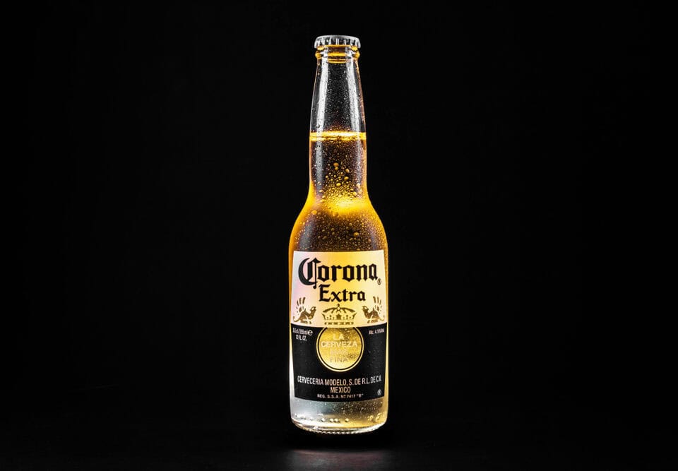 Cold,Corona,Beer,On,Black,Background